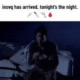 a man sitting on a boat with the words insvg has arrived tonight 's the night above him