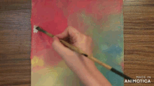 a painting is being painted with a brush and made in animatica