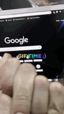a person is using a laptop with a google search bar