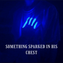 a glow in the dark t-shirt with the words something sparked in his chest