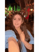a woman is taking a picture of herself in a blurry photo