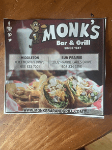 a flyer for monk 's bar and grill shows a monkey holding a beer