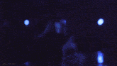 a group of women are dancing on a stage with the words gifsaespa visible in the corner