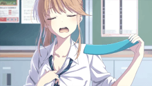 a girl in a white shirt and blue tie is yawning in front of a bulletin board