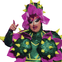 a drag queen is wearing a green and purple outfit with spikes