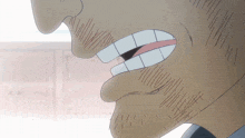 a close up of a man 's mouth with a beard