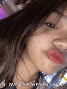 a close up of a woman 's face with the words " i love my boyfriend yall " on the bottom