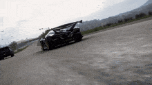 a black sports car with a license plate that says ' yjc '