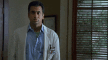 a man in a lab coat with the words too bad it is n't true behind him