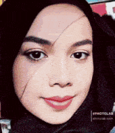 a close up of a woman 's face with a photolab watermark