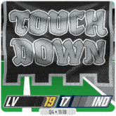 a banner that says touch down is on a green field