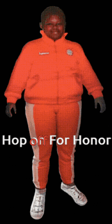 a man in a supreme jacket and pants is standing in front of a black background