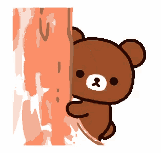 a brown teddy bear is peeking behind a wall .