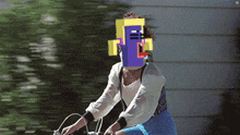 a woman is riding a bike with a pixelated face