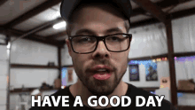 a man with glasses says have a good day