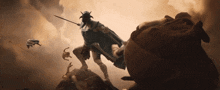 a painting of a man with horns holding a spear in a cloudy sky