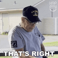 a man wearing a hat that says us navy veteran
