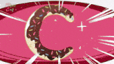 a cartoon drawing of a donut with the letter c on a pink background