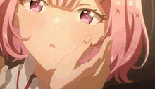 a girl with pink hair is being touched by someone 's hand