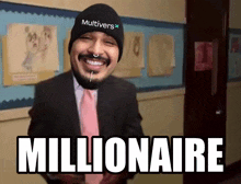 a man wearing a beanie that says multivers is smiling and says millionaire