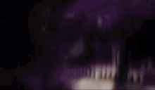 a white picket fence is surrounded by a purple background .