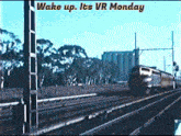 a train going down the tracks with the words wake up its vr monday above it