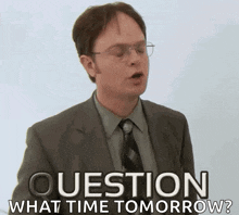 a man in a suit and tie is asking the question what time tomorrow