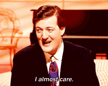 I Almost Care Stephen Fry GIF - I Almost Care Stephen Fry Clapping GIFs