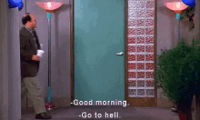 a man in a suit and tie is standing in front of a door and says good morning .