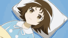 a little girl is laying on a bed with a pillow and looking up .