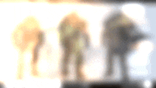 a blurry picture of three people standing in front of a white background