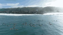 A Group Of Surfers Surfing With Friends GIF