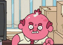 a pink cartoon character is sitting at a desk in front of a television and boxes .