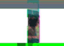 a blurry picture of a woman sitting in a bathtub with a green border .
