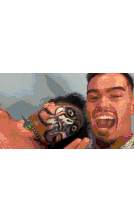 two men are posing for a selfie in a wrestling ring