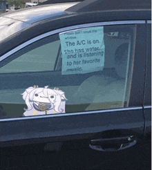 a car with a sign in the window that says the a/c is on