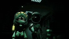 two robots are standing next to each other in a dark room .