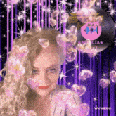 a woman is surrounded by pink hearts and a record that says ' agenzia ' on it