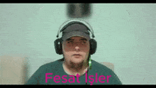 a man wearing headphones with the words " fesat işler " written above him