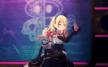 a girl in a black dress is dancing on a stage with a robot in the background