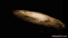 a black hole in the middle of a galaxy with the website makeagif.com in the lower right corner