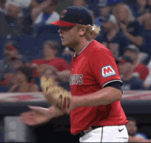 a baseball player wearing a red jersey that says chas on it