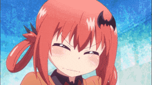 a girl with red hair and a bat on her head makes a face