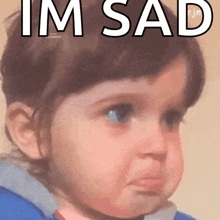 a little girl making a sad face with the words i 'm sad above her