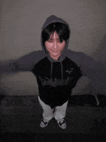 a person wearing a hoodie that says thunder