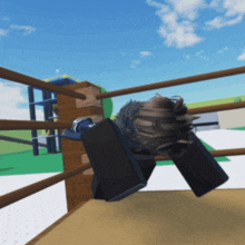 a person is laying on their back in a boxing ring with a blue sky in the background