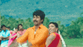 a man and a woman are dancing together in a field