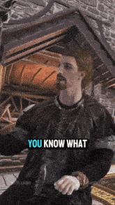 a man with a beard and a black jacket says you know what