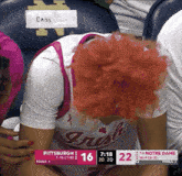 a woman in a pittsburgh irish jersey sits in a stadium