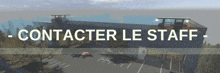 a sign that says contacter le staff with a picture of a building